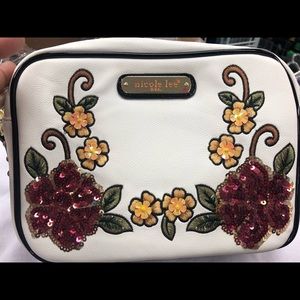 White Nicole lee flowered embossed wristlet